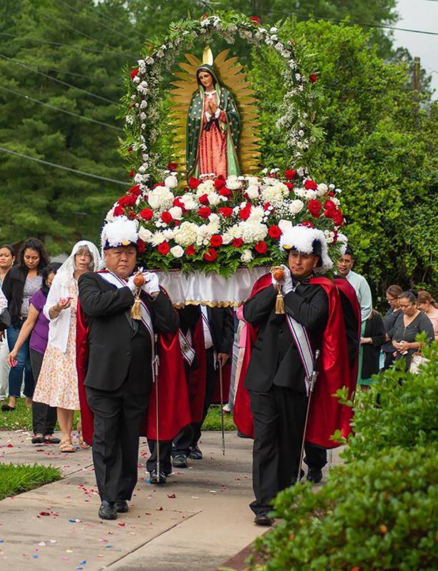 St. Joseph Church in Asheboro held its annual May Crowning May 12 before Mass with Father Philip Kollithanath, pastor. Leading the outdoor procession were the parish’s First Communicants and children carrying baskets of rose petals to toss along the path.