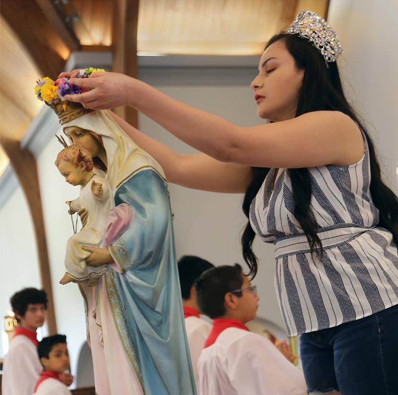 SHELBY — A May crowning was held after Mass May 12 at St. Mary Help of Christians Church in Shelby. Participating children wore their First Communion attire. (Giuliana Polinari Riley | Catholic News Herald)