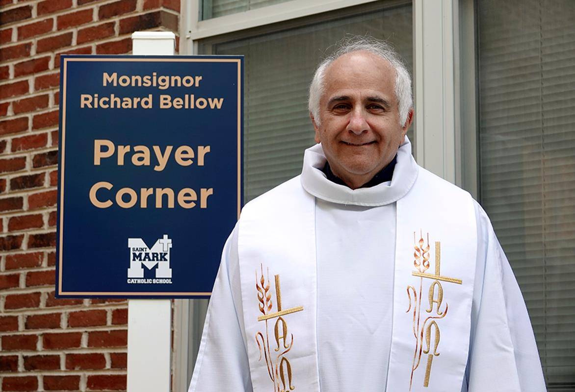 Students at St. Mark School also held a May crowning last week. In addition, the school honored Mon-signor Richard Bellow, who is retiring from ministry at the school this year after nearly 15 years of ser-vice, unveiling a Prayer Corner in his name. 