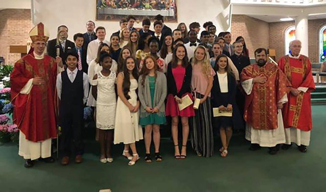 Bishop Peter Jugis recently confirmed 41 young people at St. Paul the Apostle Church in Greensboro. (Photo provided)