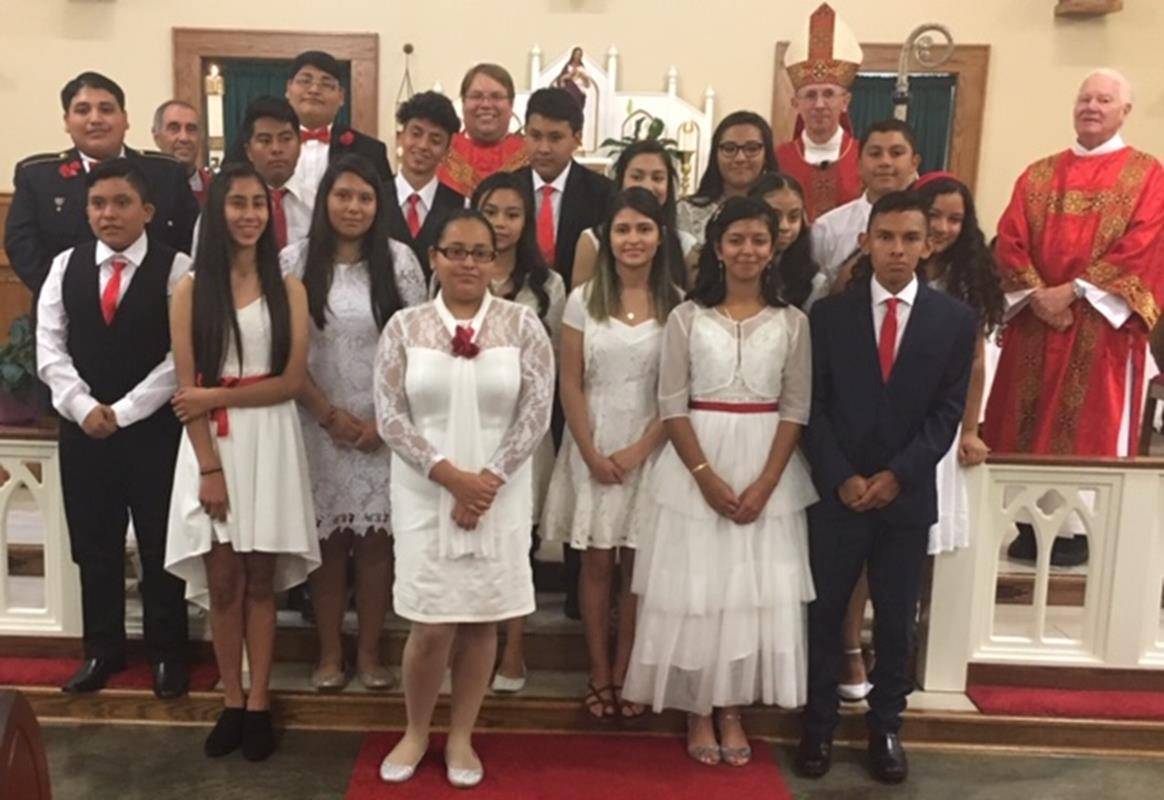 Thirteen young people from St. Francis of Assisi Church in Jefferson and five young people from St. Frances of Rome Mission in Sparta confirmed their faith before the Church on the feast of the Holy Guardian Angels Oct. 2.. (Patrick Hession | Catholic New