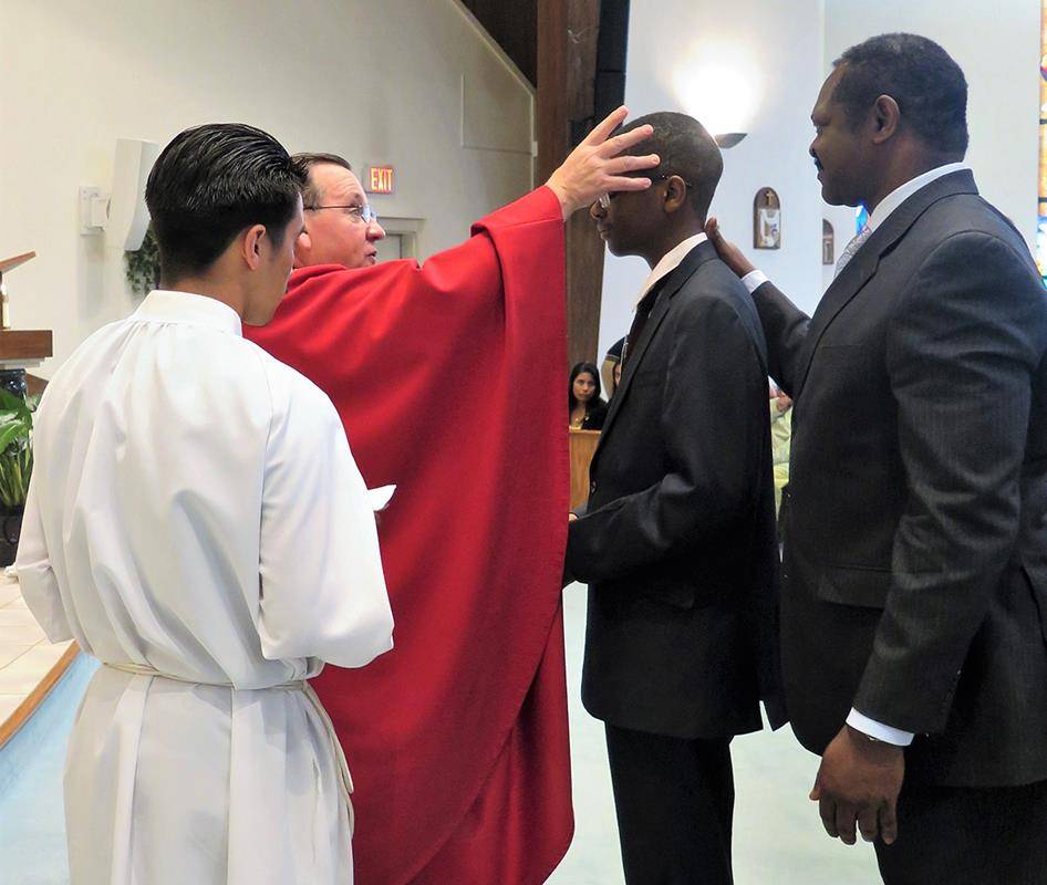 On May 8, Father Thomas J. Kessler, pastor, administered the sacrament of confirmation to 26 candidates at St. Philip the Apostle Church in Statesville. (Photos provided by Connie Ries)