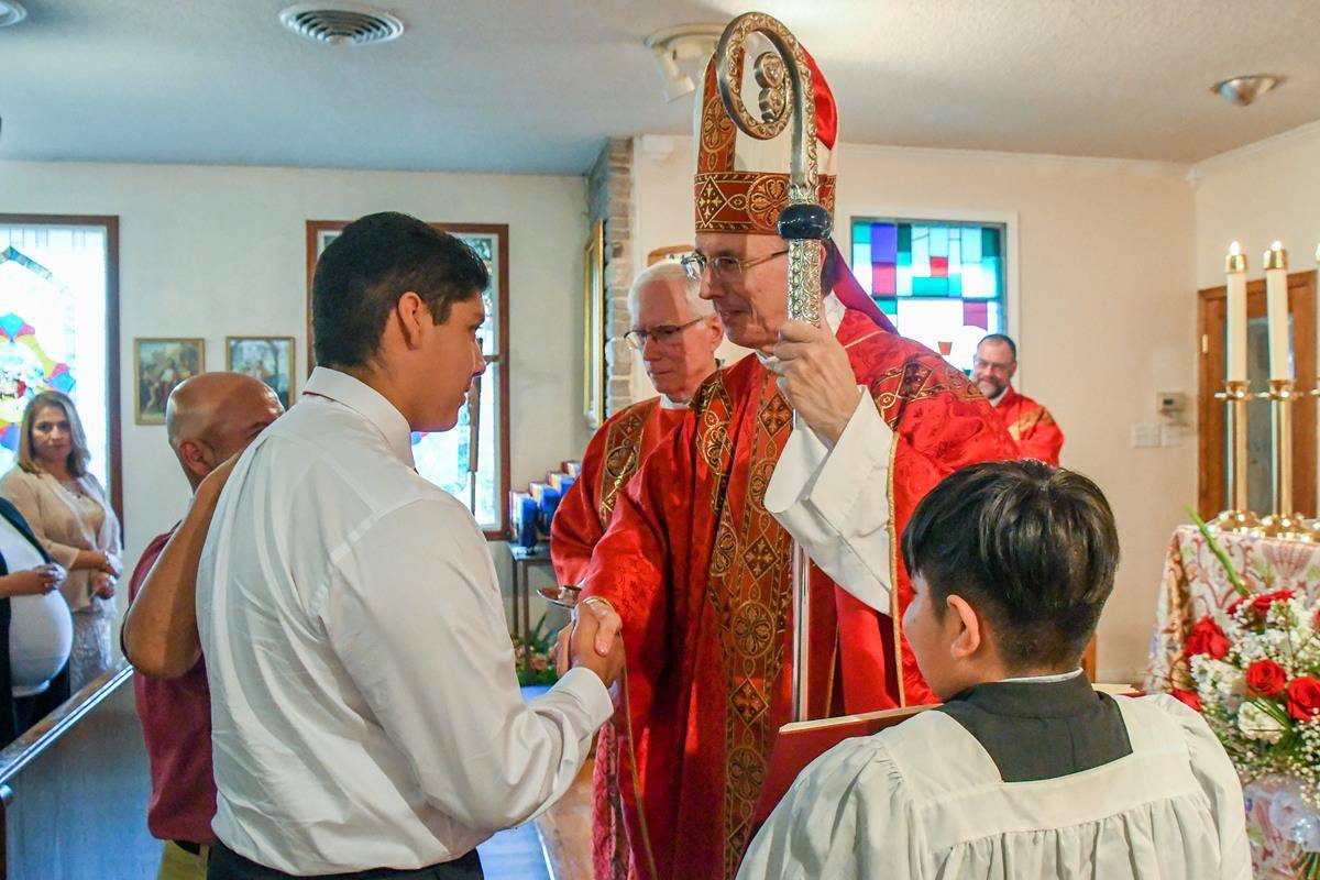 Bishop Peter Jugis recently confirmed young people at Holy Redeemer Church in Andrews. (Photos by Phil Roche | Catholic News Herald)