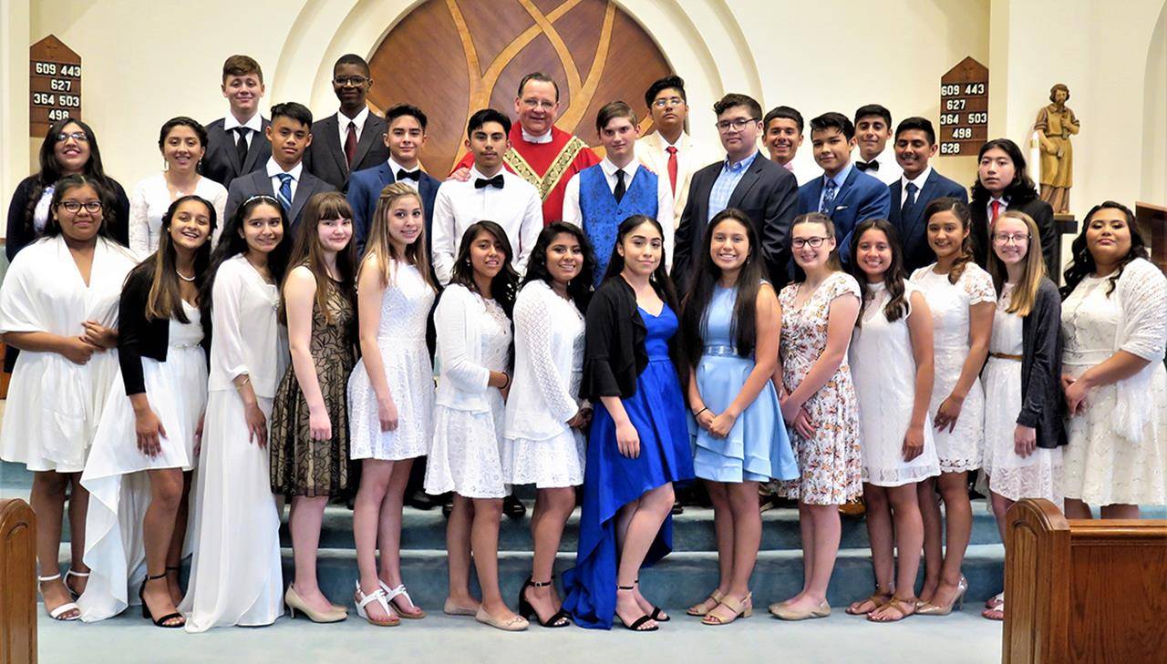 On May 8, Father Thomas J. Kessler, pastor, administered the sacrament of confirmation to 26 candidates at St. Philip the Apostle Church in Statesville. (Photos provided by Connie Ries)