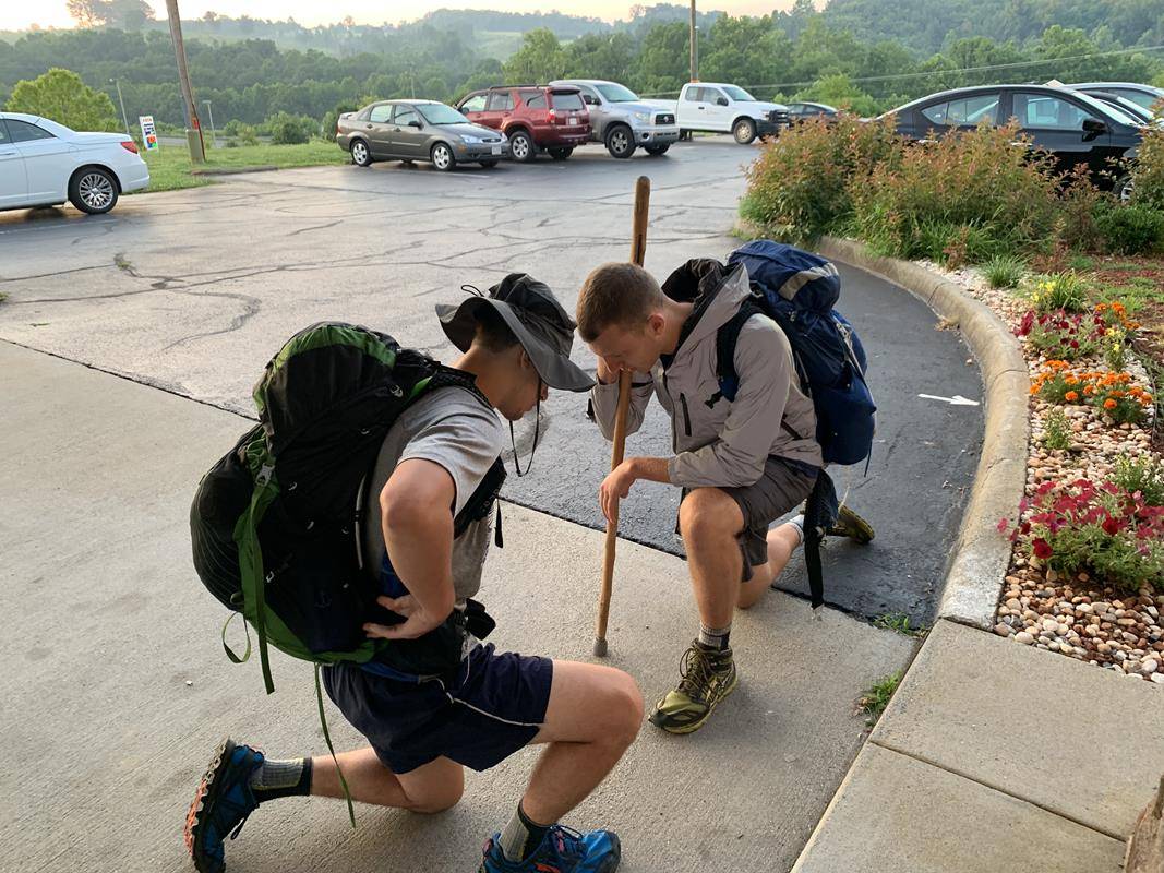 John Harrison and his brother, St. Joseph College seminarian Matthew Harrison, kneel in prayer before heading out for another day of walking during their 325-mile pilgrimage to the National Shrine of St. Elizabeth Ann Seton in Emmitsburg, Md. 