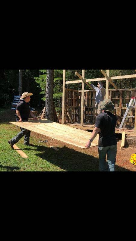 St. Joseph Workers provided hands-on help this summer. Here St. Joseph College seminarian Sebastian Alvarez Jaramillo splits wood during the project to build a wood shed. (Photos provided by Amy Burger) 