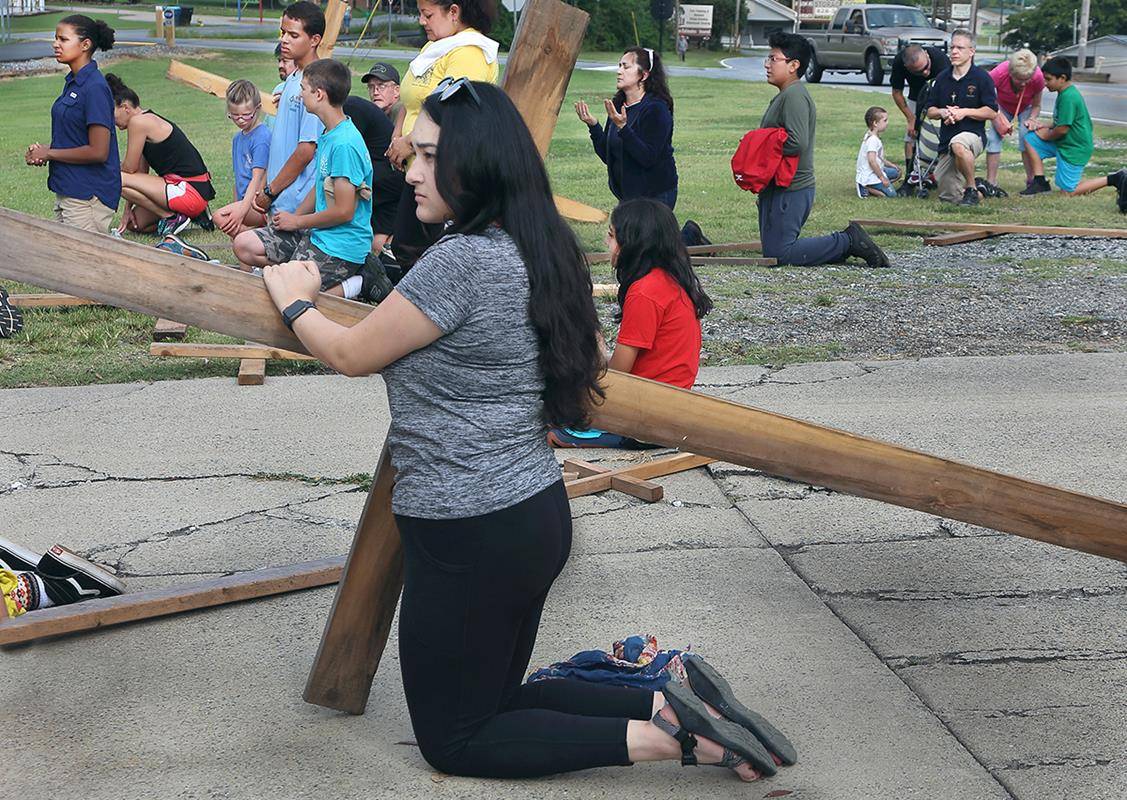 Kneeling in prayer at Grace of God.