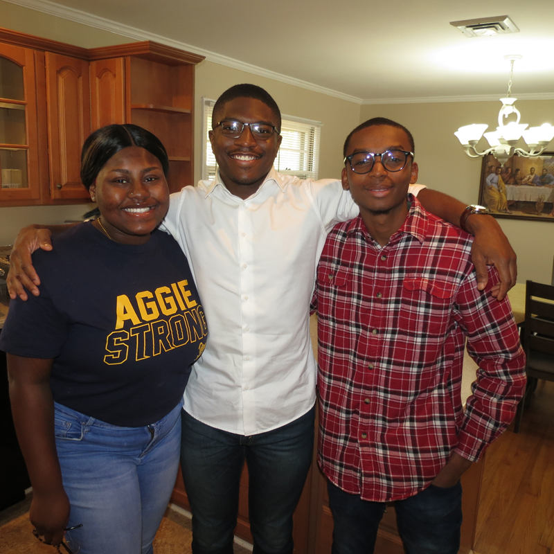 Students (from left) Nina Blue, Osinor Kakhu and Myles Njenga look forward to using the new Campus Ministry location. (Georgianna Penn, correspondent)