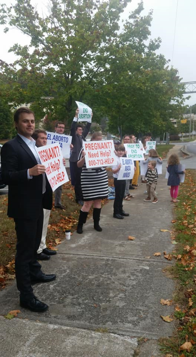More than 25 parishioners of St. Elizabeth Church in Boone and St. Bernadette Church in Linville turned out on a cloudy, windy, misty day to tell Boone that they believe in the sanctity of human life from conception to natural death. (Photo via Facebook)