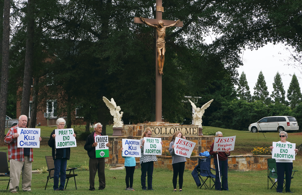 FOREST CITY —The Knights of Columbus of Immaculate Conception sponsored the annual Life Chain Prayer Service on Oct. 6. Participants prayed silently while holding pro-life signs and facing Main Street. (Photo by Giuliana Polinari Riley)