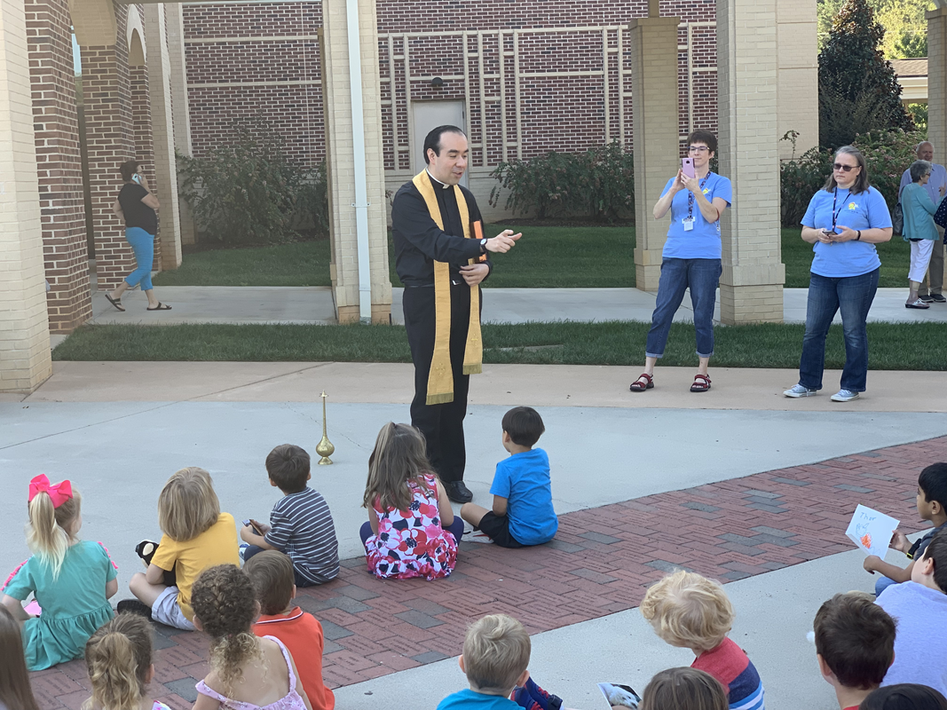 HUNTERSVILLE — Father Alfonso Gámez blessed stuffed animals and pictures of the children’s pets on the Feast Day of St. Francis of Assisi at St. Mark Church preschool. (Photos by Mary Stapleton.)