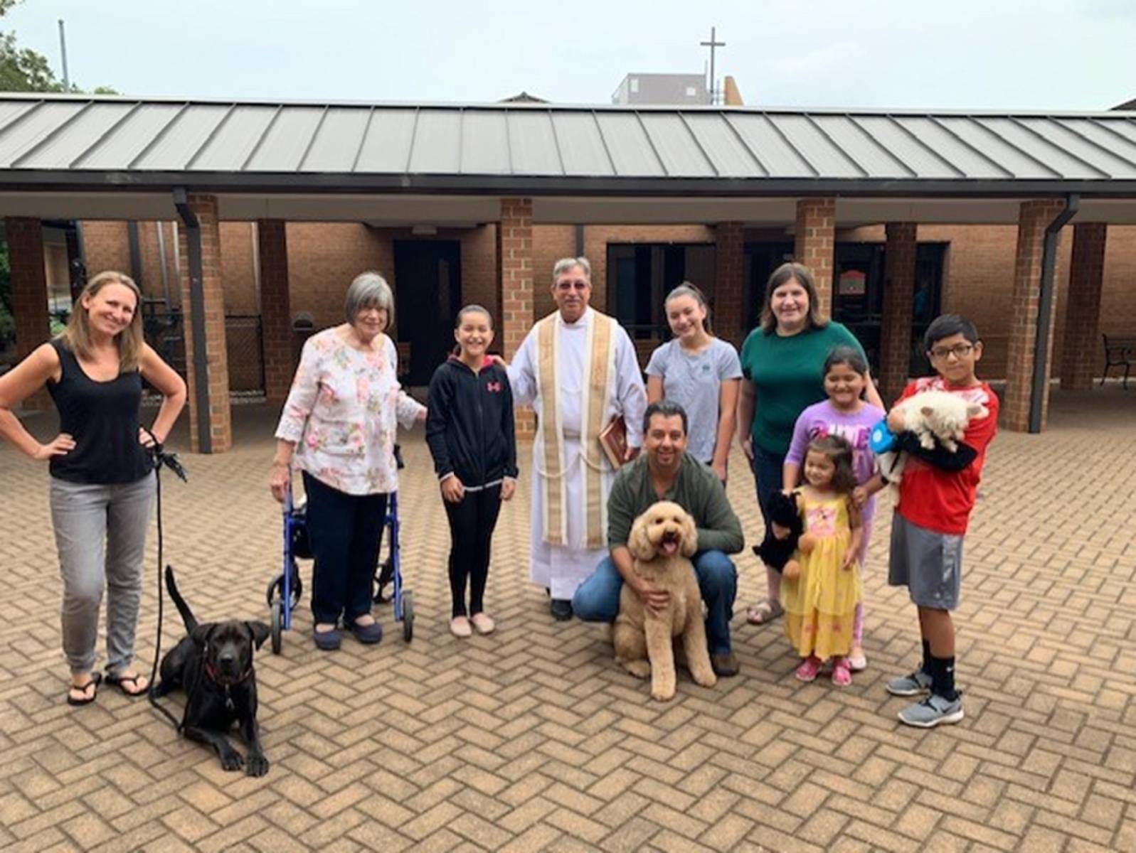 MOORESVILLE — Parishioners of St. Therese brought their animals to the courtyard on the first Saturday in October to receive a blessing from Father Mark Lawlor. (Photo provided by Lisa Cash)