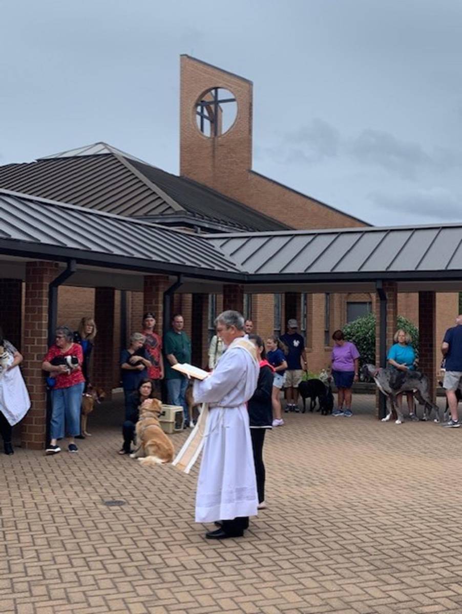 MOORESVILLE — Parishioners of St. Therese brought their animals to the courtyard on the first Saturday in October to receive a blessing from Father Mark Lawlor. (Photo provided by Lisa Cash)