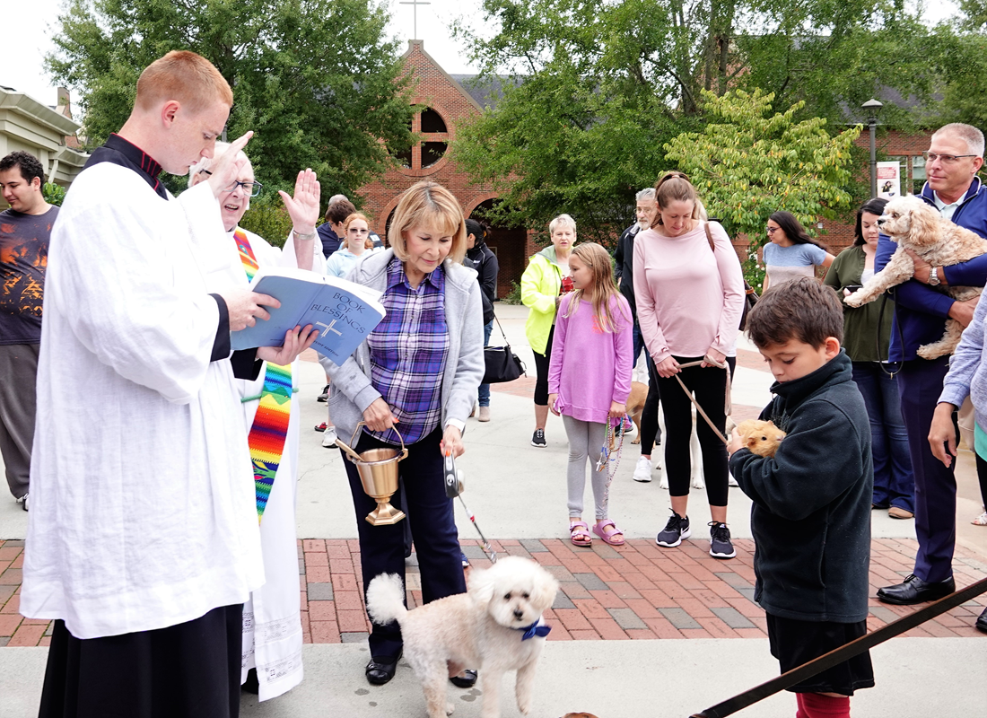 HUNTERSVILLE — Deacon Ron Sherwood blessed the animals after the 9 a.m. Mass at St. Mark Church on Saturday, Oct. 5. He went person by person, sprinkling each of their pets with holy water after asking for the animal’s name. Seminarian Patrick Martin assi