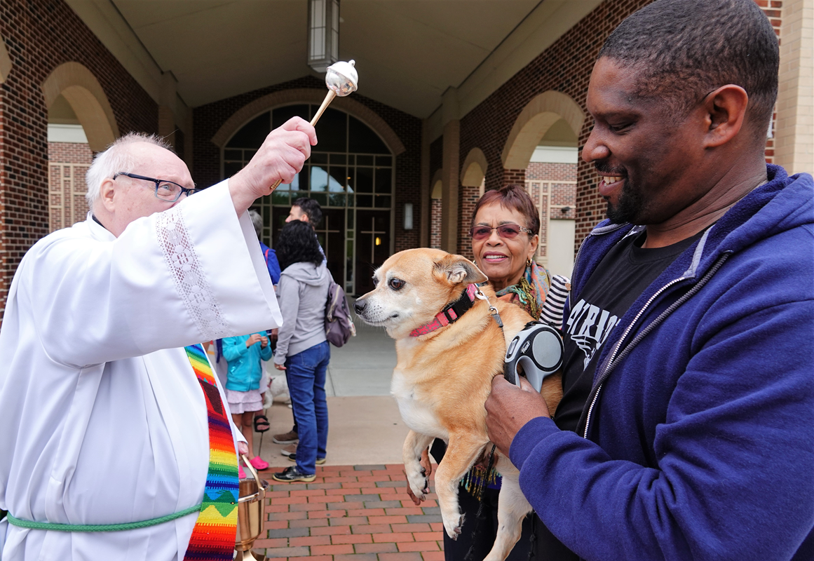 HUNTERSVILLE — Deacon Ron Sherwood blessed the animals after the 9 a.m. Mass at St. Mark Church on Saturday, Oct. 5. He went person by person, sprinkling each of their pets with holy water after asking for the animal’s name. Seminarian Patrick Martin assi