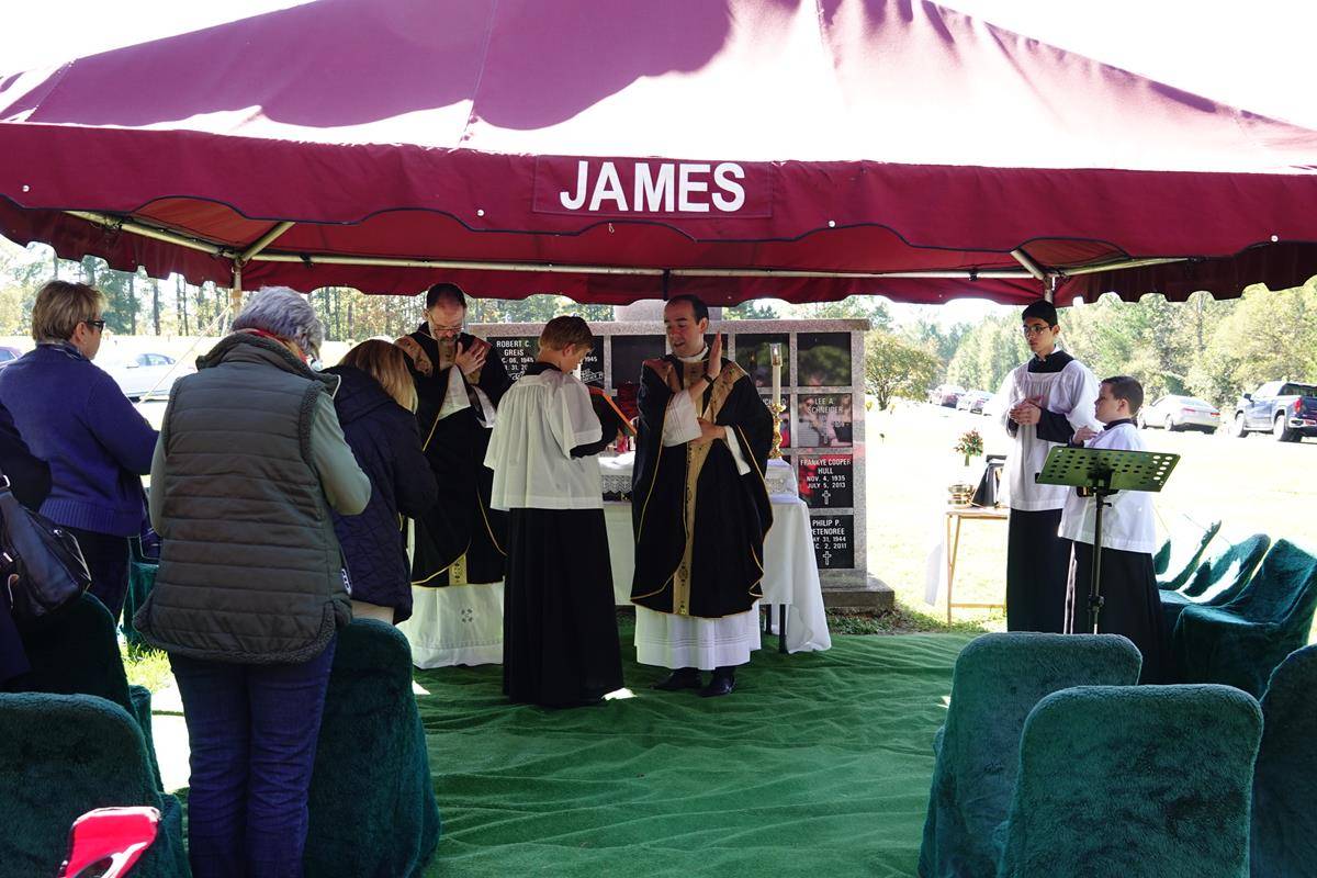 About 100 people attended the All Souls’ Day Cemetery Mass at Northlake Memorial Garden Cemetery. In his homily, Fr. Alfonso Gámez reminded us of the power of our prayers to those who have passed (Photos provided by Amy Burger)