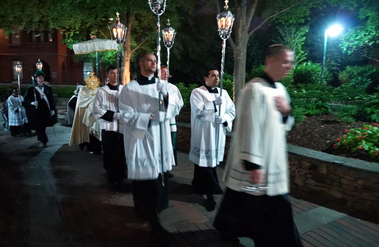 The Blessed Sacrament was carried in procession from the Charlotte Convention Center Friday night across the street to St. Peter Church, where Eucharistic Adoration will continue throughout the night.JPG