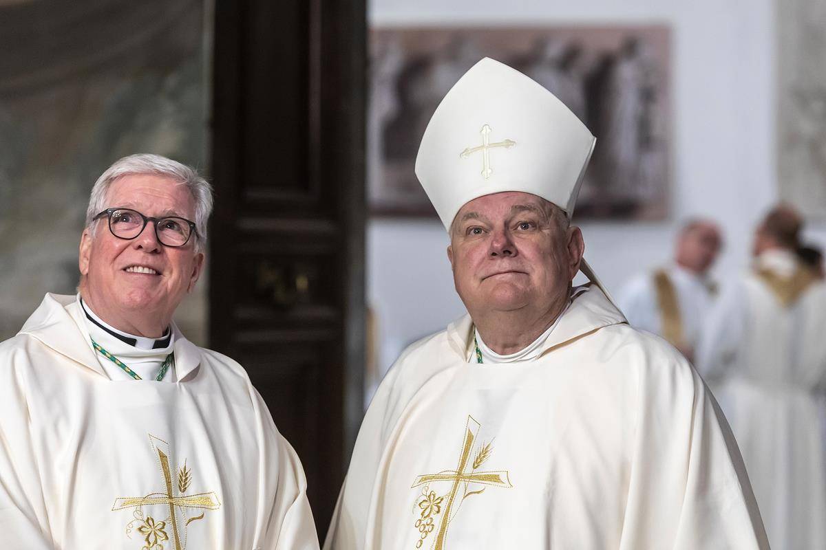 Bishop Frank J. Dewane of Venice, Fla., and Archbishop Thomas J. Wenski of Miami, Fla., are pictured as U.S. bishops from Florida, Georgia, North Carolina and South Carolina prepare to concelebrate Mass at the Basilica of St. John Lateran in Rome.