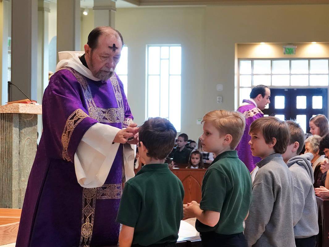 HUNTERSVILLE — St. Mark School students participate in Ash Wednesday Mass at St. Mark Church Feb. 26. (Photos provided by Amy Burger)