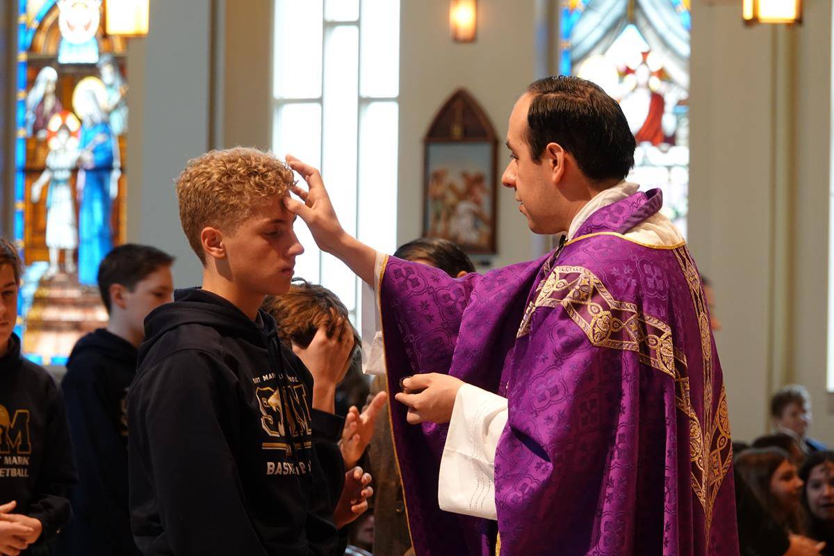 HUNTERSVILLE — St. Mark School students participate in Ash Wednesday Mass at St. Mark Church Feb. 26. (Photos provided by Amy Burger)