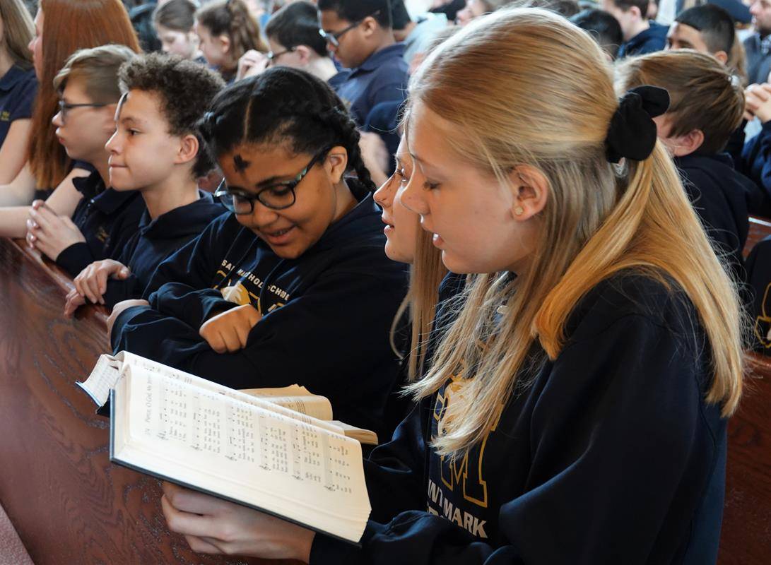 HUNTERSVILLE — St. Mark School students participate in Ash Wednesday Mass at St. Mark Church Feb. 26. (Photos provided by Amy Burger)