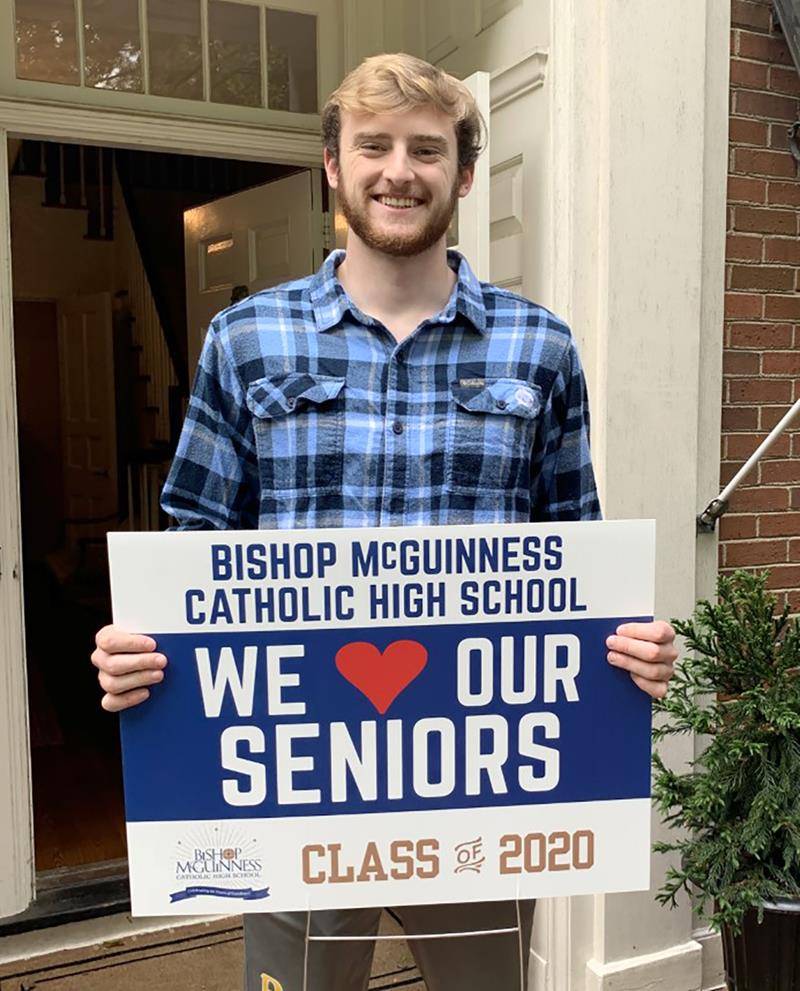 BMHS senior on porch w sign 2020 (Copy)