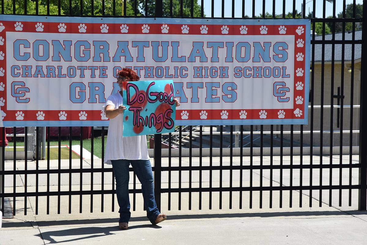 IMG_0056 CCHS drive through teacher w sign (Copy)