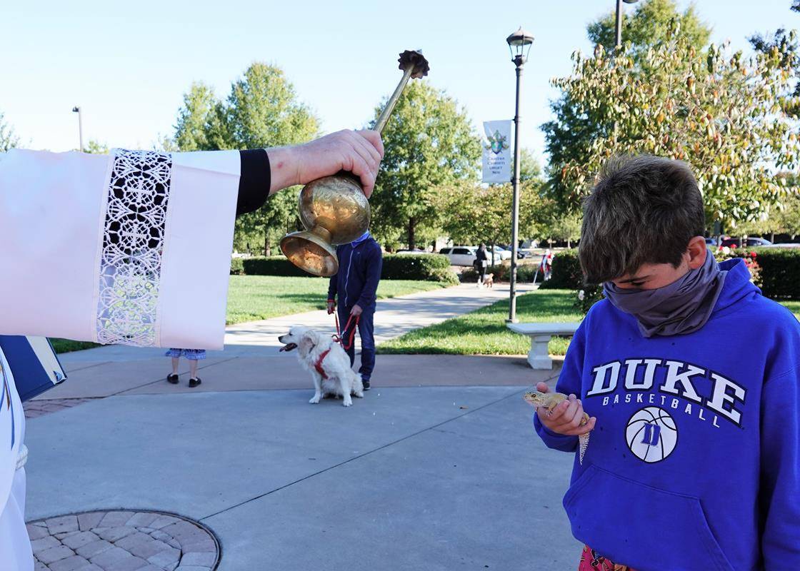 HUNTERSVILLE — Deacon Tom McGahey blessed parishioners — and their pets — at the annual Blessing of the Pets held in honor of St. Francis of Assisi on Oct. 3. (Photos provided by Amy Burger)