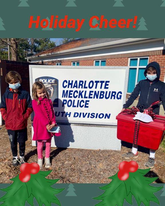 The Panduro family was among many parishioners at St. Matthew Church in Charlotte who donated and delivered buckets of holiday cheer before Christmas to the Charlotte-Mecklenburg Police Department, in thanks for their daily sacrifices (Photo via Facebook)