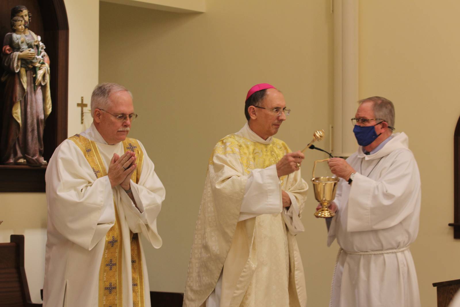 Bishop Peter Jugis prepares to bless the new chapel at Holy Family Church in Clemmons Jan. 27.