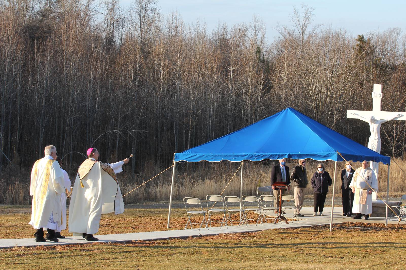 Bishop Peter Jugis, Father Peter Nouck and Deacon John Harrison processed along a walkway during the blessing of a Catholic section of the Westlawn Gardens of Memory cemetery in Clemmons on Jan. 27.