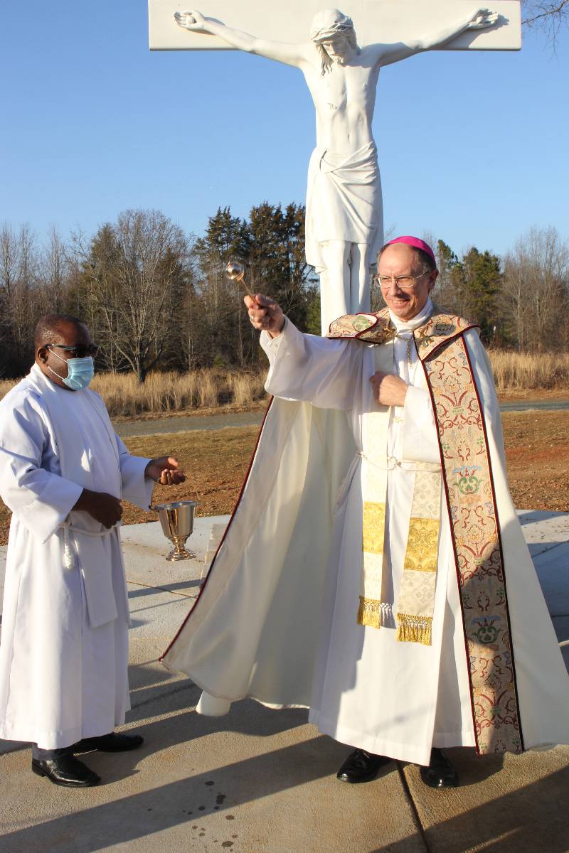 Bishop Peter Jugis blessed the crucifix and the grounds around the new Catholic section of Westlawn Gardens of Memory in Clemmons Jan. 27.