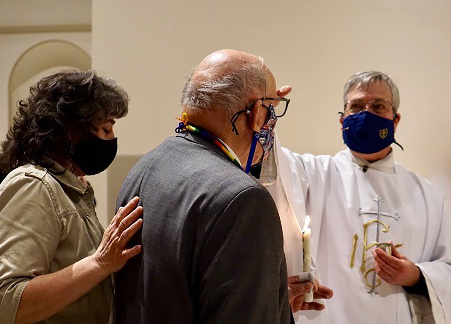 A. John Ayer, 94, was received into the fullness of the faith at the Easter Vigil April 3 at St. Therese Church in Mooresville. Administering the sacrament of confirmation is Father Mark Lawlor, pastor. (Photo provided by Lisa Cash)