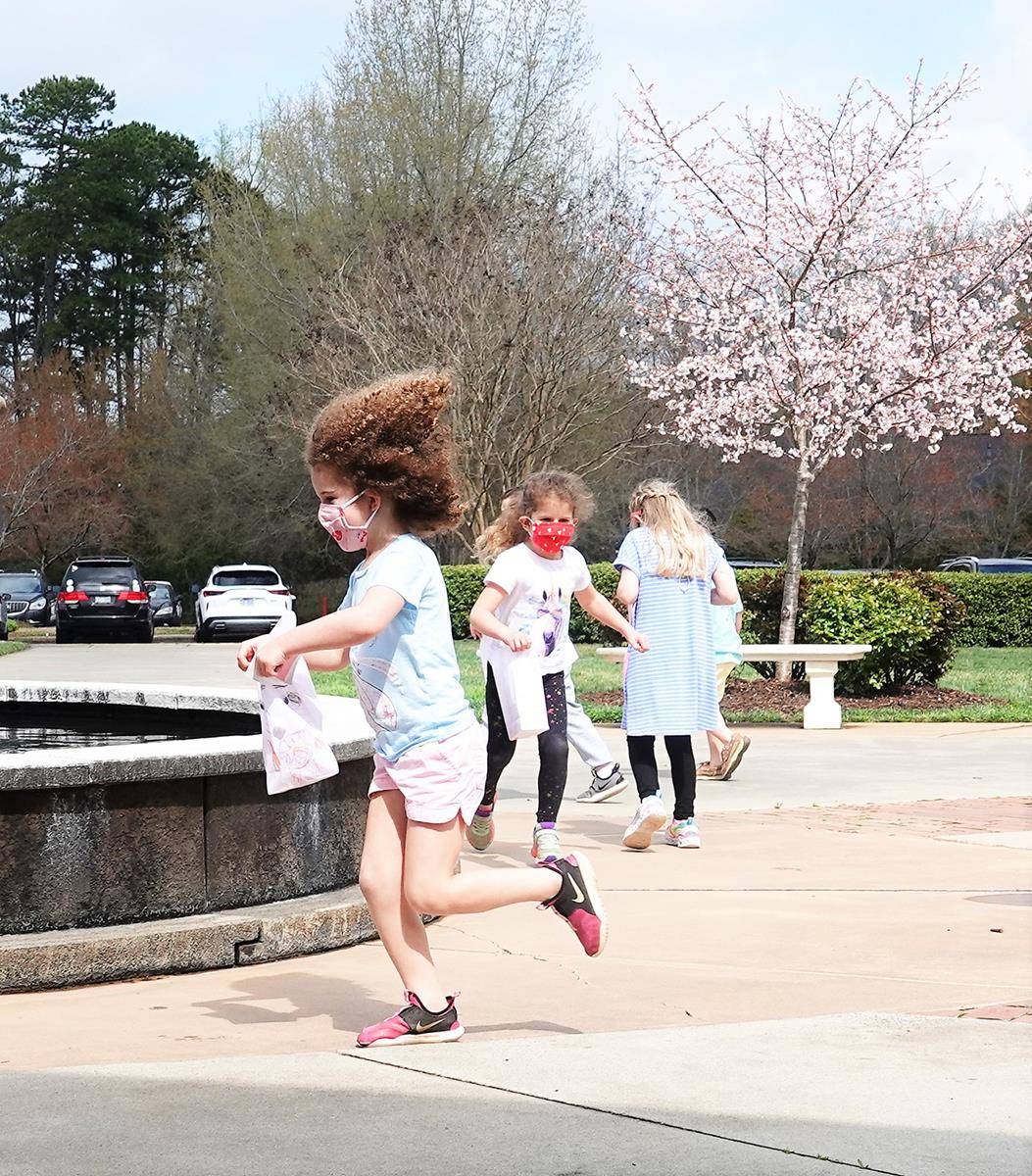 Preschoolers brought their joy to the campus of St. Mark Church once again, as on their final day before spring break, they were treated to an Easter egg hunt around the piazza of the church in Huntersville. (Photos provided by Amy Burger)