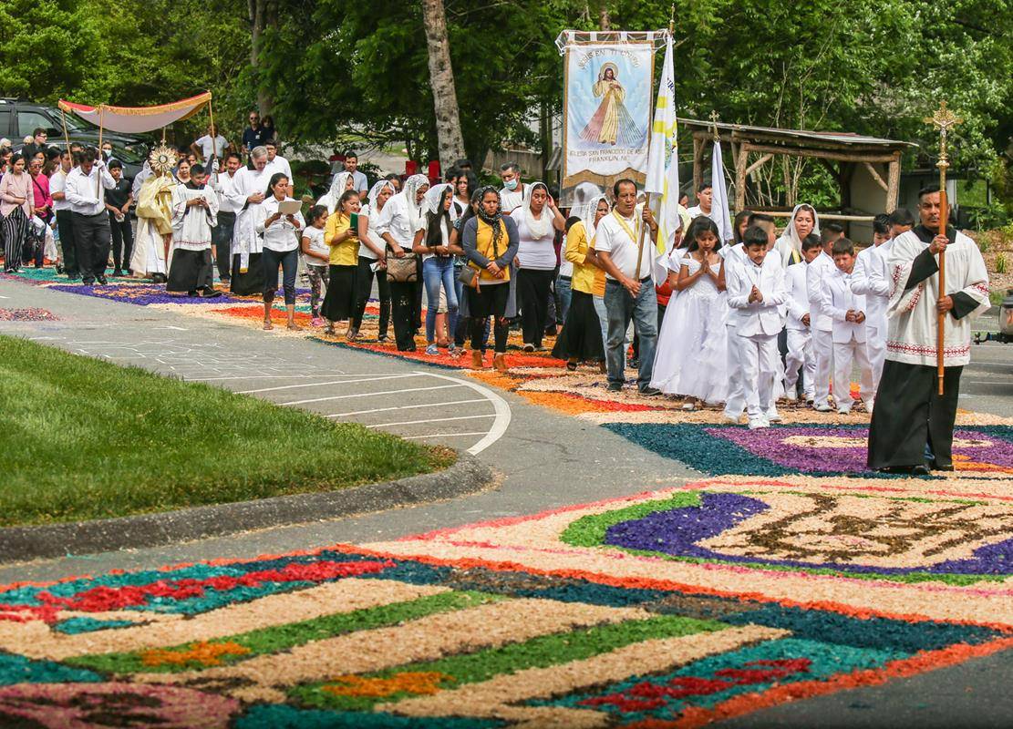 Each section is decorated by families, small groups or individuals with art depicting various aspects of the Catholic faith.