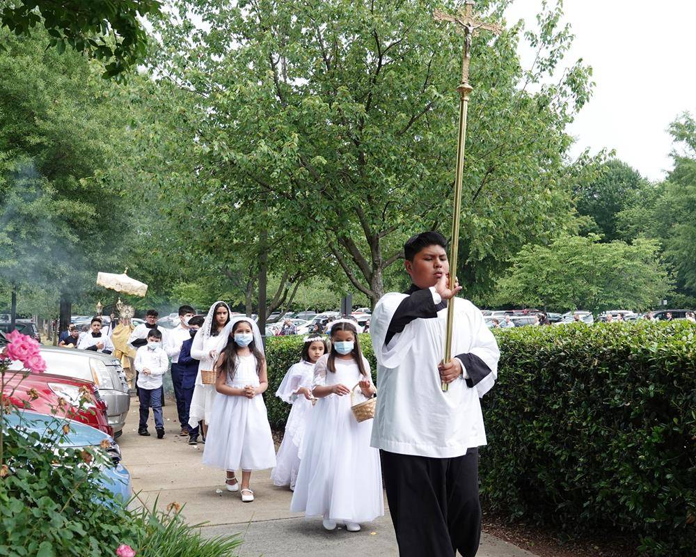 There was also a Corpus Christi procession after the 9 am Mass, also led by Fr. Gámez.