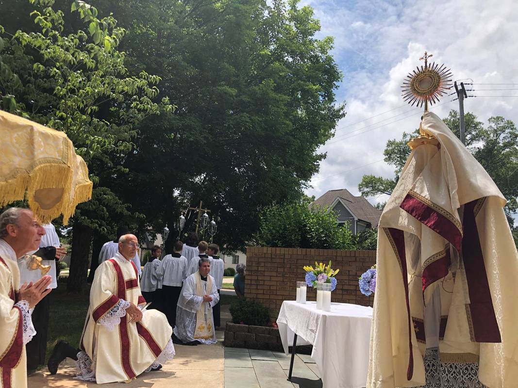A Corpus Christi procession was held at St. Ann Church in Charlotte led by Father Timothy Reid. (Photos by SueAnn Howell)