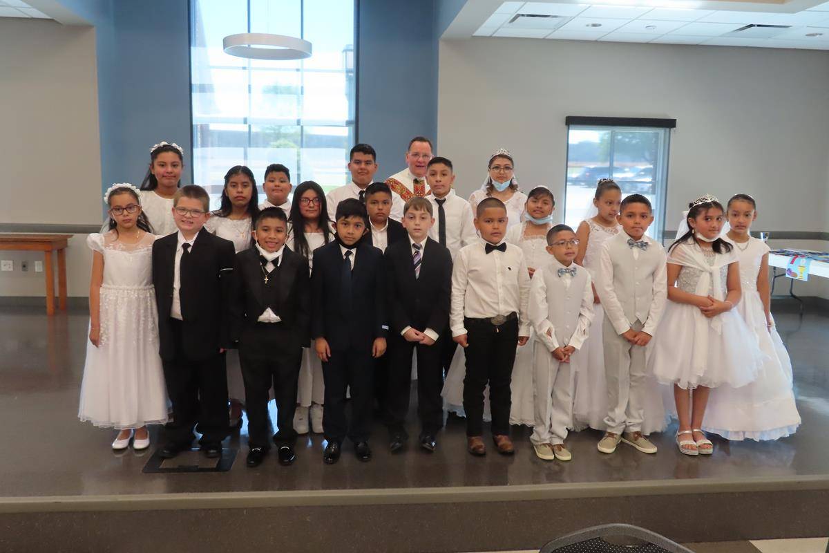 STATESVILLE — Twenty children and young adults received their first Holy Communion at St. Philip the Apostle Church May 1. Father Thomas J. Kessler celebrated Mass for the First Communicants and their families. (Photo provided by Connie Ries)