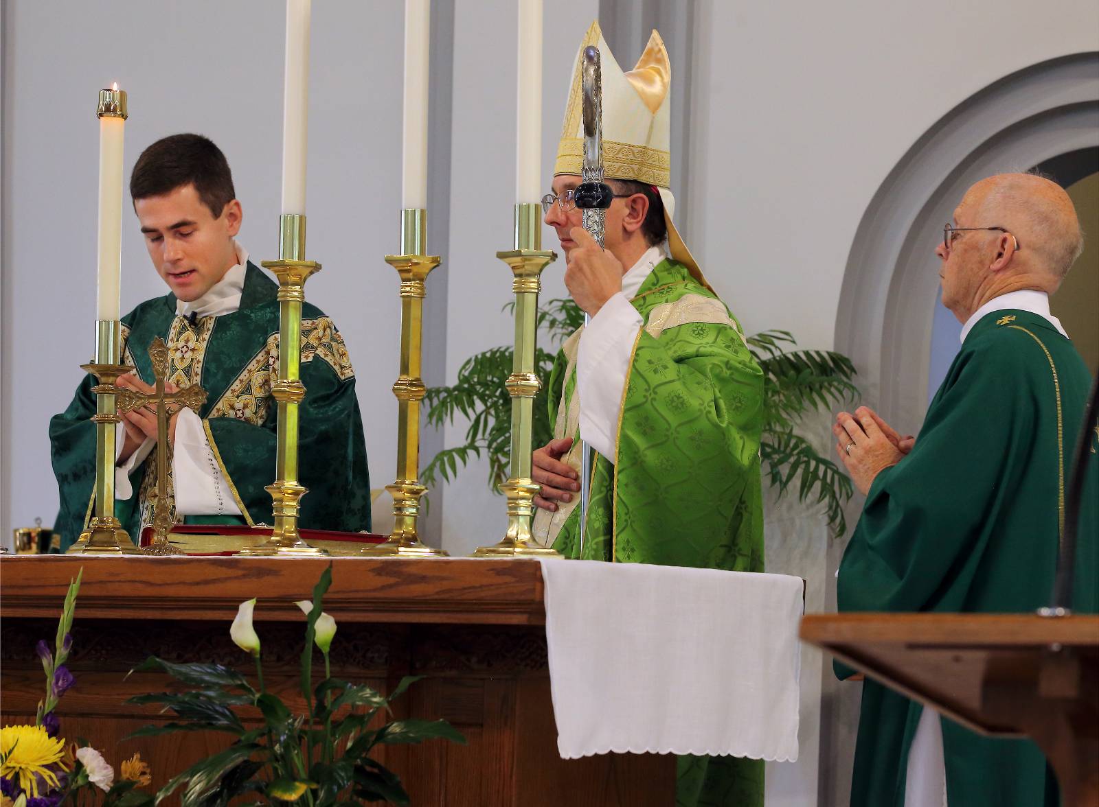 Father Peter Ascik makes his profession of faith at the start of his installation as pastor of St. Mary, Help of Christians Parish in Shelby and Christ the King Mission in Kings Mountain.