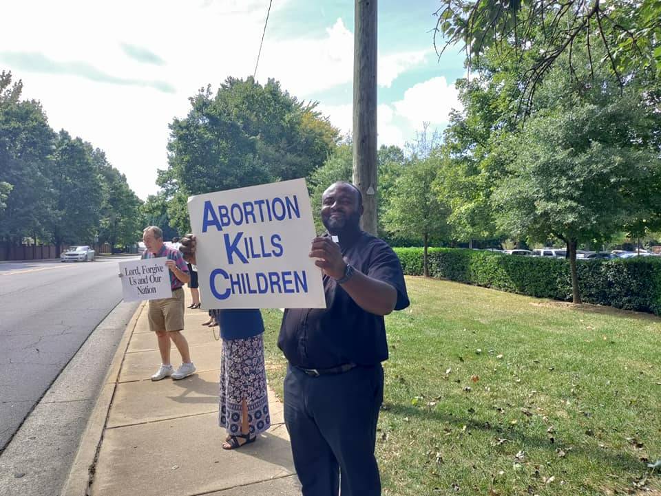 Pro-life supporters lined Park Road in Charlotte outside St. Vincent de Paul Church to pray for the Sanctity of Human Life. (Photos via Facebook) 