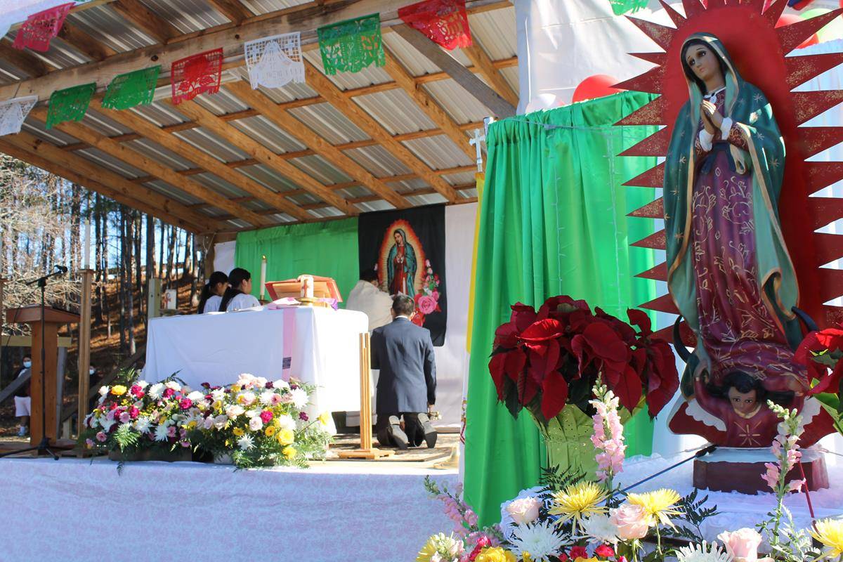 Father Fidel Melo, pastor of St. James Church in Hamlet, celebrated Mass in honor of Our Lady of Guadalupe. (Photo by César Hurtado)