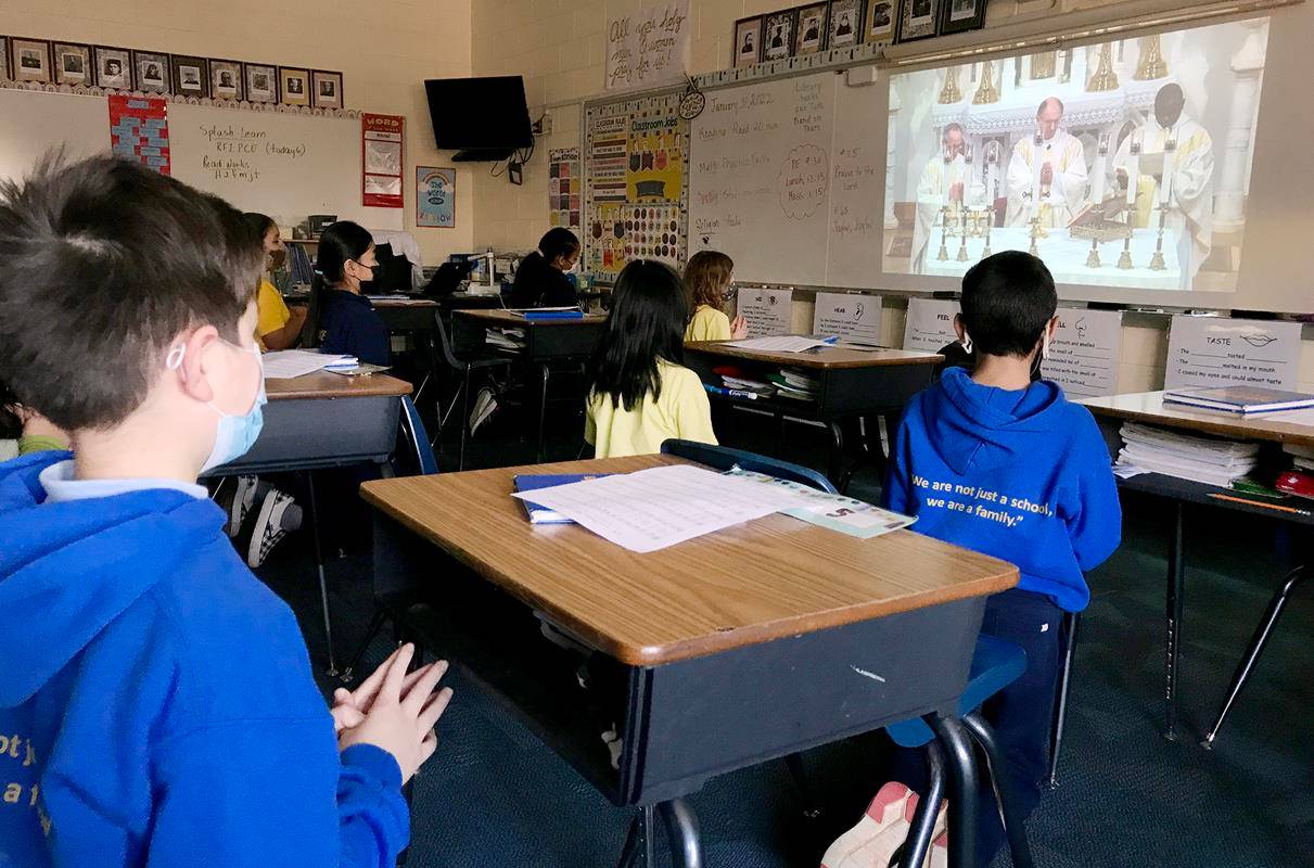 Students at Our Lady of the Assumption School in Charlotte participate in the livestream Mass with Bishop Peter Jugis Jan. 31 to kick off Catholic Schools Week. (Photos by César Hurtado, Catholic News Herald)