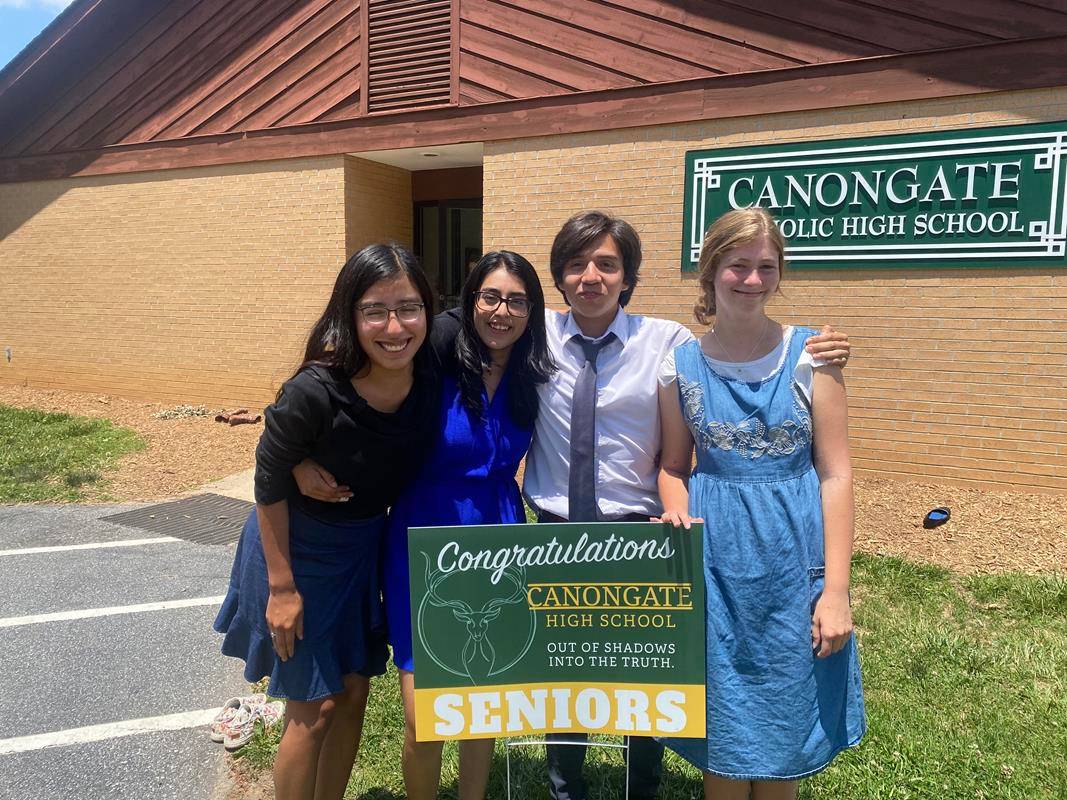 Four members of Canongate Catholic High School’s Class of 2022 in Arden graduated June 4. They are the first graduates from this small affiliate high school to graduate since Canongate joined the Diocese of Charlotte Catholic Schools system. (Photo provid
