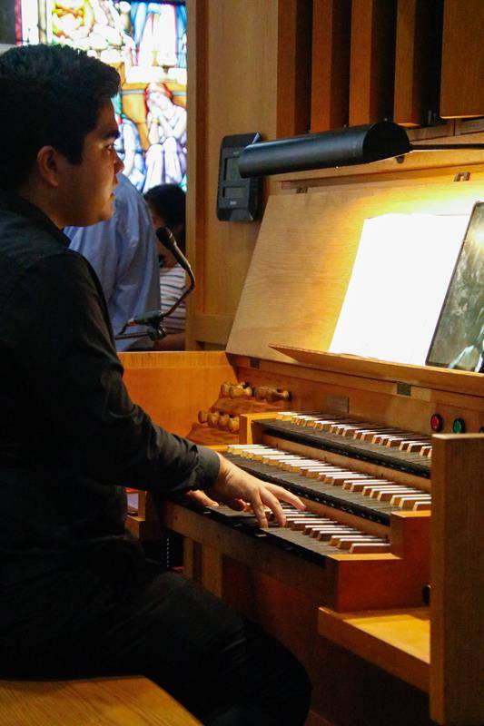 A.J. Lyon plays the church’s rare, 2,226-pipe Kleuker organ during the Sept. 17 Mass.