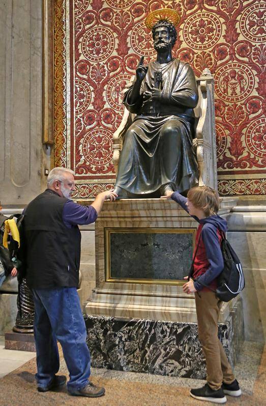 Pilgrims traditionally touch  St Peter bronze   statue in St Peter_ (1)
