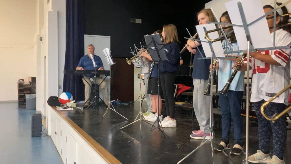 Mr. David Shoff, music teacher, led the band in some hype songs to get the crowds amped up during the game.