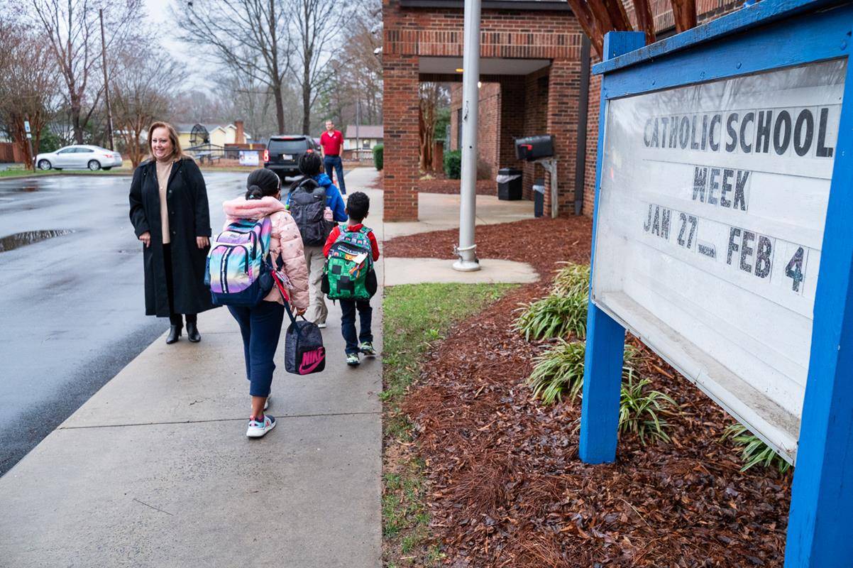 Students head to school at Our Lady of the Assumption.