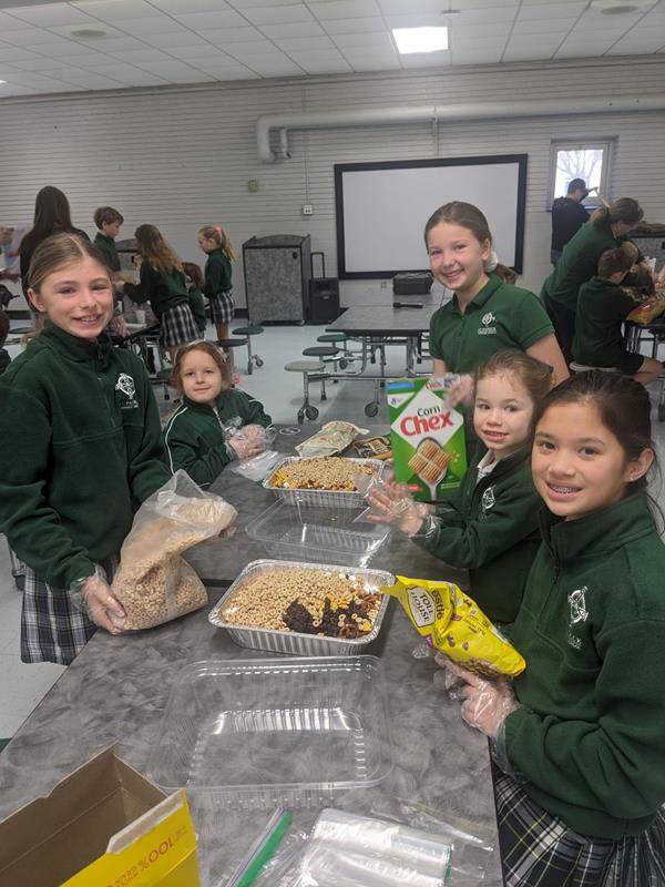 The students at St. Patrick School packaged Snackwells to be sold during lunch, and the monies will be donated to Cross Catholic Outreach to support a clean water project.  