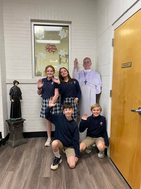 Sixth-grade students at St. Pius X School in Greensboro enjoy a surprise “visit” from Pope Francis.