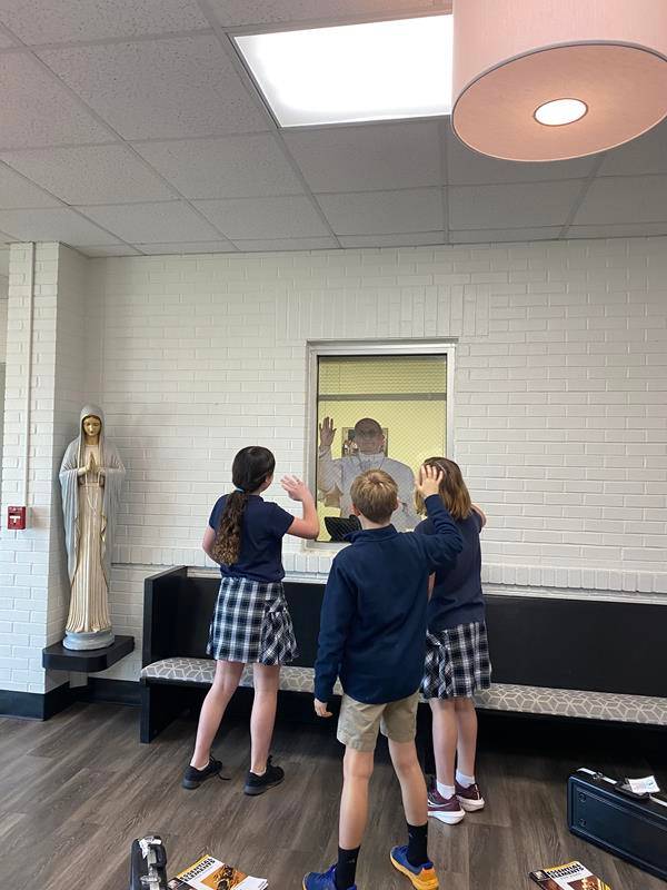 Sixth-grade students at St. Pius X School in Greensboro enjoy a surprise “visit” from Pope Francis.